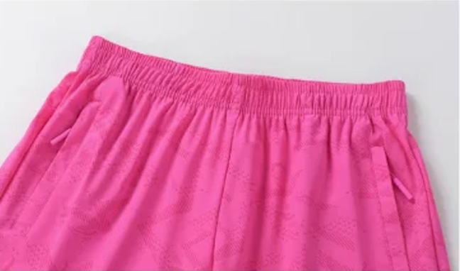 Short de sport femme à poche zippée