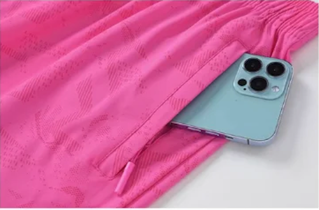 Short de sport femme à poche zippée